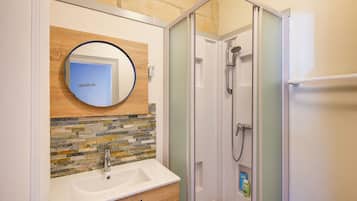 Shower, towels, soap, toilet paper