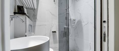 Shower, hair dryer, towels, soap