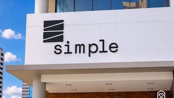 A building with a sign that reads 'simple'.