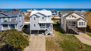 A beachfront residential area with houses featuring balconies and a view of the ocean. - Semi-Oceanfront, Ocean Views! 225ft to Beach! -Pool, Hot Tub,Pool Table,Dogs OK! (Kitty Hawk)