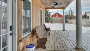 A wooden porch with a bench, a garage, and a snow-covered yard. - 'The Olde Westerlo Village House' - Summer Escape (Westerlo)