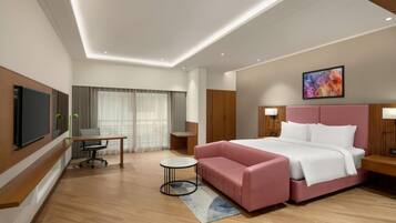 Junior Suite, 1 King Bed | In-room safe, desk, laptop workspace, blackout curtains