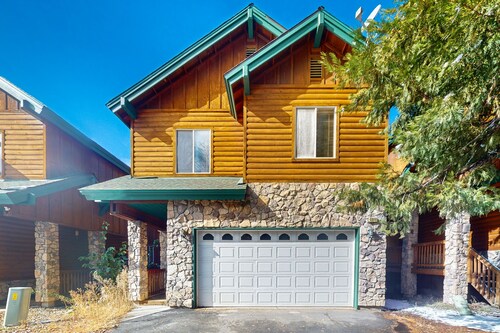 Serene cabin with deck, modern appliances, and fireplace