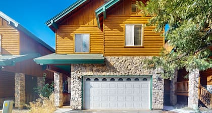 Serene cabin with deck, modern appliances, and fireplace