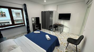 Standard Room, City View | Minibar, desk, soundproofing, iron/ironing board