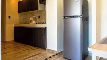 Departamento Deluxe, vista a la alberca | Cocina privada