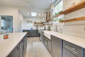 Fridge, stovetop, dishwasher, coffee/tea maker