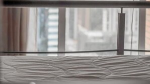 A room with a large window, a bed, and a lamp. - NYC Residence Flat condominio (São Paulo)