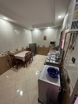 Fridge, microwave, toaster, cookware/dishes/utensils