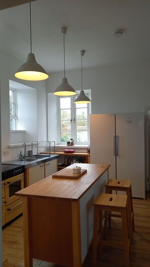 Fridge, dishwasher, cookware/dishes/utensils, dining tables