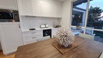 Fridge, microwave, stovetop, coffee/tea maker