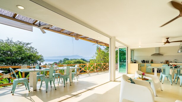 A modern kitchen with a view of the outdoors. - Luxury House Pool fire Pit & Lake view (Jojutla)