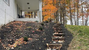 A house with a covered porch leading to a stone staircase. - Charming countryside home in the heart of Amish Country (Fredericktown)