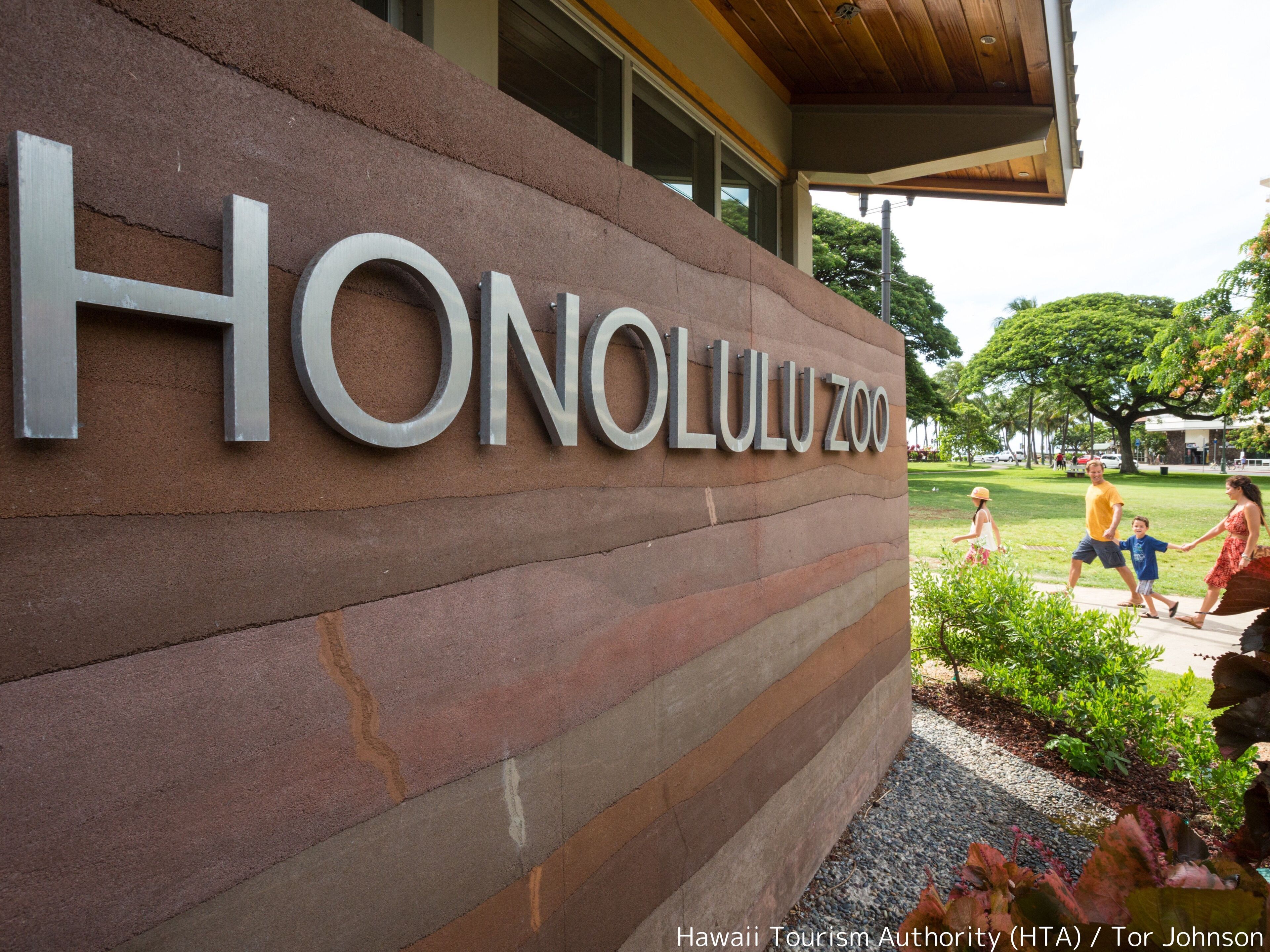 The Honolulu Zoo sign with a brick facade and large metal letters.