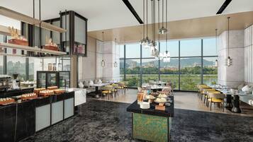 A modern dining area with a high ceiling, large windows, and a city view.