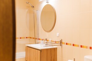 Shower, hair dryer, towels, soap