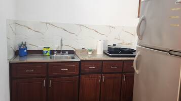 Fridge, microwave, stovetop, coffee/tea maker