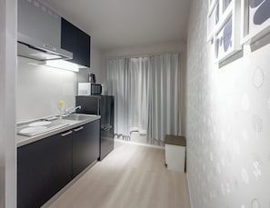 Chambre Triple | Cuisine privée