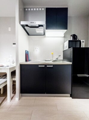 Chambre Triple | Cuisine privée