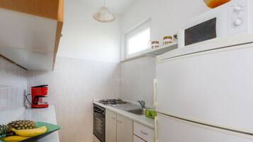 Apartment (One Bedroom Apartment with Balcony) | Private kitchen | Fridge