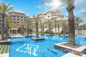 Outdoor pool - LUX The Grandeur Palm Garden View Suite (Dubai)