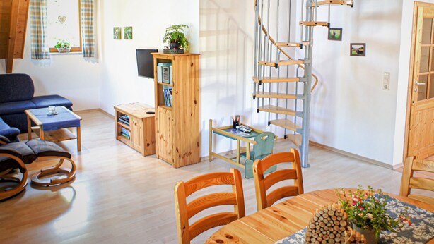 A modern interior with a spiral staircase, wooden furniture, and a cozy seating area. - Farmhouse 'Weißtanne' with Mountain View, Private Terrace and Wi-Fi (Oberkirch)