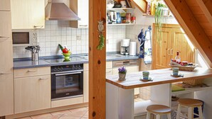 A kitchen with a built-in oven, a microwave, and a coffee maker. - Farmhouse 'Weißtanne' with Mountain View, Private Terrace and Wi-Fi (Oberkirch)