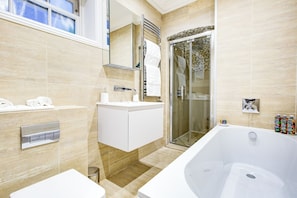 Shower, hair dryer, towels, soap