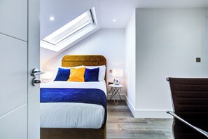 1 bedroom, desk, iron/ironing board, travel crib