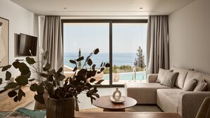 A modern living room with a large window overlooking a pool and the sea. - The Sall Suites Complex B - Sea Views (Zakynthos)