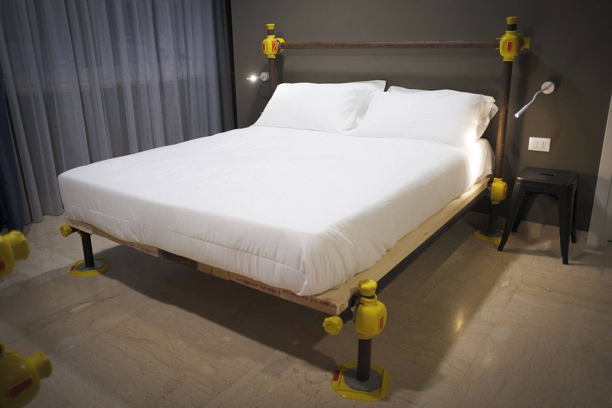 Deluxe Quadruple Room, Non Smoking | In-room safe, desk, laptop workspace, blackout drapes