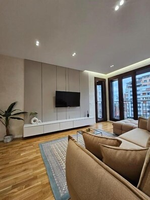 Comfort Apartment, 1 Bedroom, Balcony, City View | Living area | Flat-screen TV
