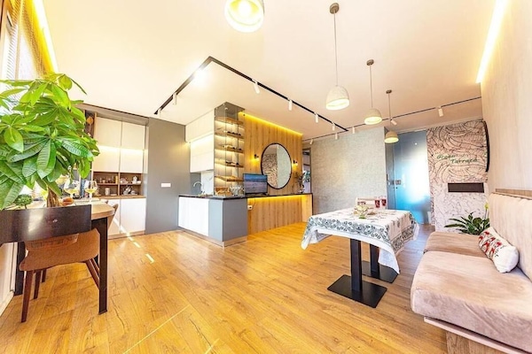 Exclusive Apartment, 4 Bedrooms, Balcony, City View | Living area | Flat-screen TV