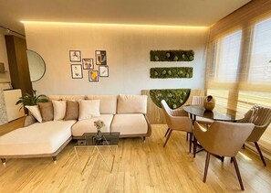 Exclusive Apartment, 4 Bedrooms, Balcony, City View | Living area | Flat-screen TV