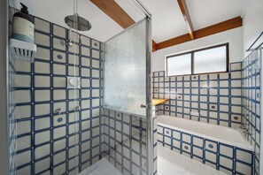 Shower, hair dryer, towels, shampoo
