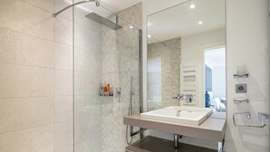 A modern bathroom with a glass-enclosed shower, a large mirror, and a dual sink vanity. - Beautiful 2P Apartment With Sunny Terrace (Cannes)