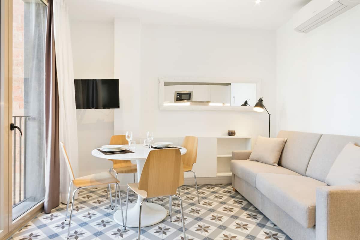 Superior Apartment, City View | Living area | Flat-screen TV