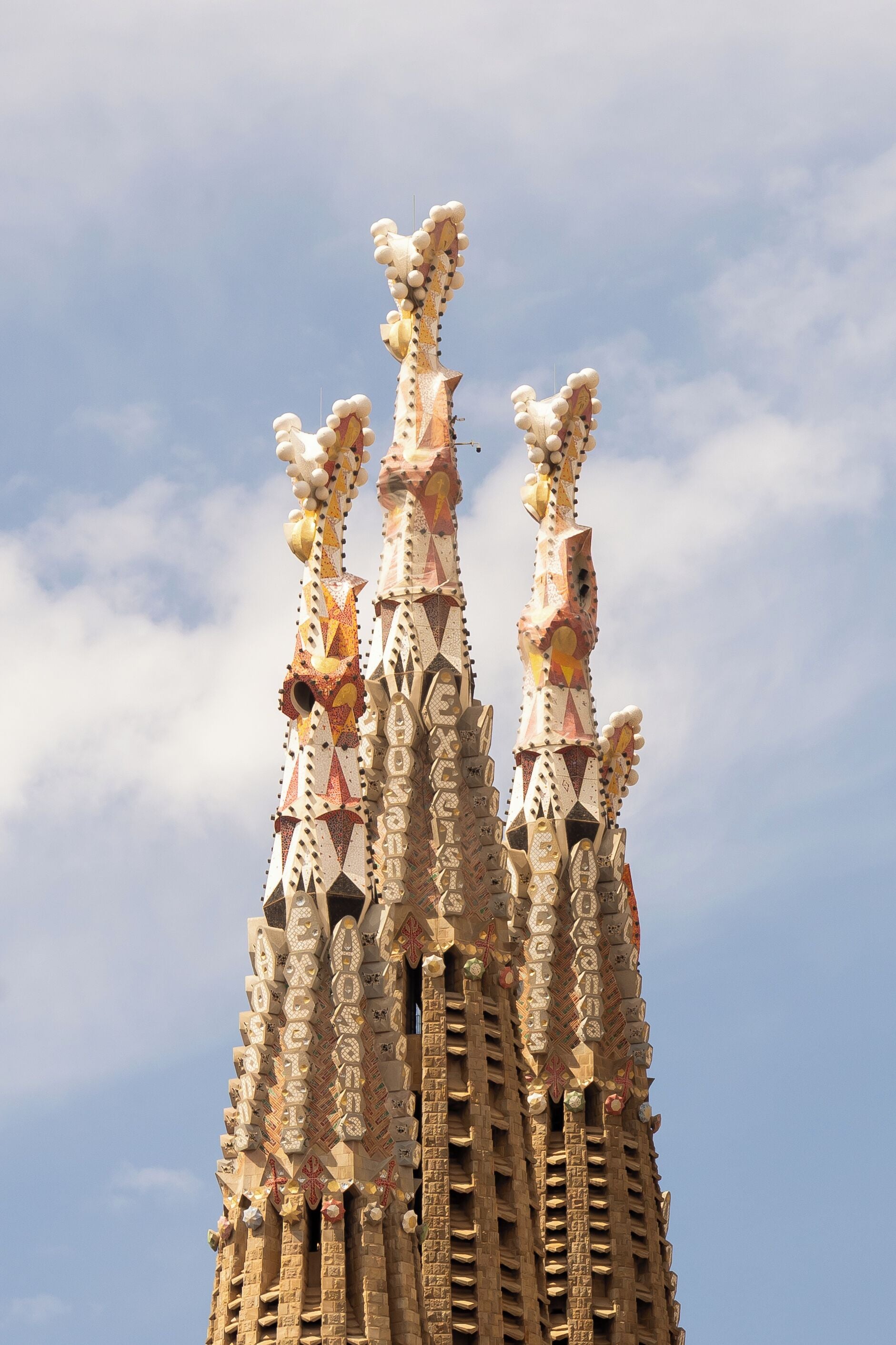 A building with a unique architectural design featuring multiple spires and decorative elements.