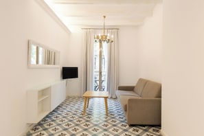 Deluxe Apartment, City View | Living area | Flat-screen TV