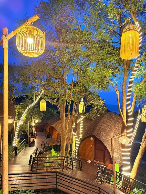 A treehouse-style building with multiple levels, connected by wooden walkways and surrounded by trees. - Phumala Lanta Seaview Resort (Ko Lanta)