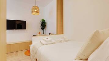 Departamento | 1 habitación, tabla de planchar con plancha y ropa de cama