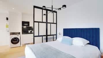Apartment | Laptop workspace, iron/ironing board, bed sheets