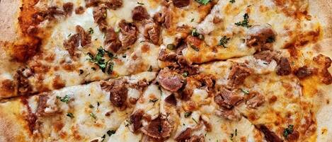 A pizza with toppings.