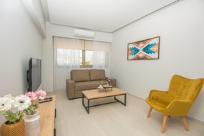 A modern living room with a sofa, coffee table, and a yellow armchair.