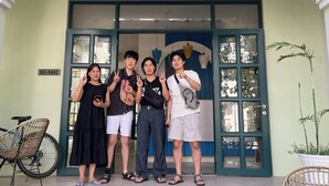 A hostel entrance with a sign reading "THE COSTI'S HOSTEL-HOMESTAY". - The Costis Homestay & Hotel  (Phu Quoc)