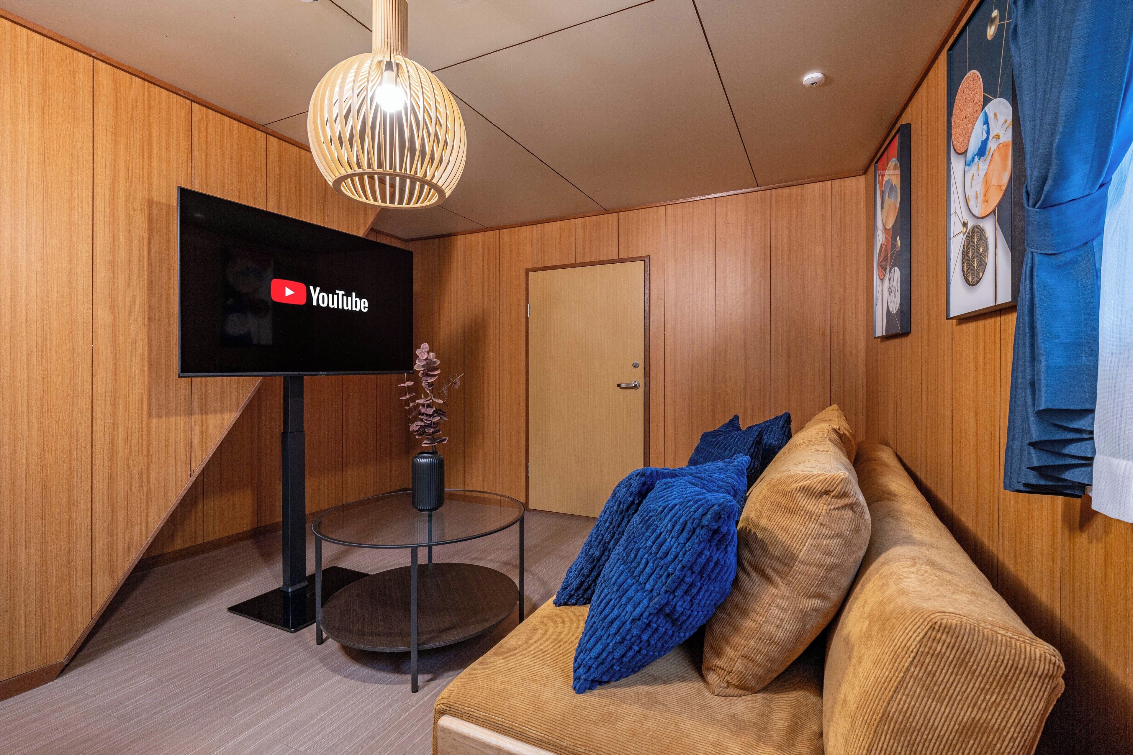 Deluxe House, Balcony | Living area | 50-inch flat-screen TV with cable channels