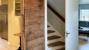 A staircase with wooden steps and a white door. - 4 Star Holiday Home in Karlskrona (Eringsboda)