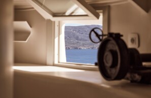 Enjoy breathtaking views of the surrounding mountains and water from this room's large window.