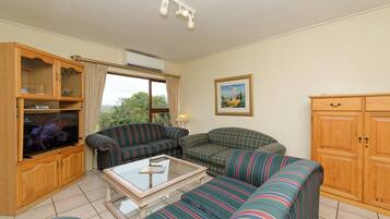 Basic Villa, Patio, Garden View | Living area | 40-inch LCD TV with cable channels