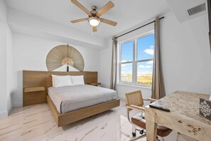 2 habitaciones, escritorio y tabla de planchar con plancha